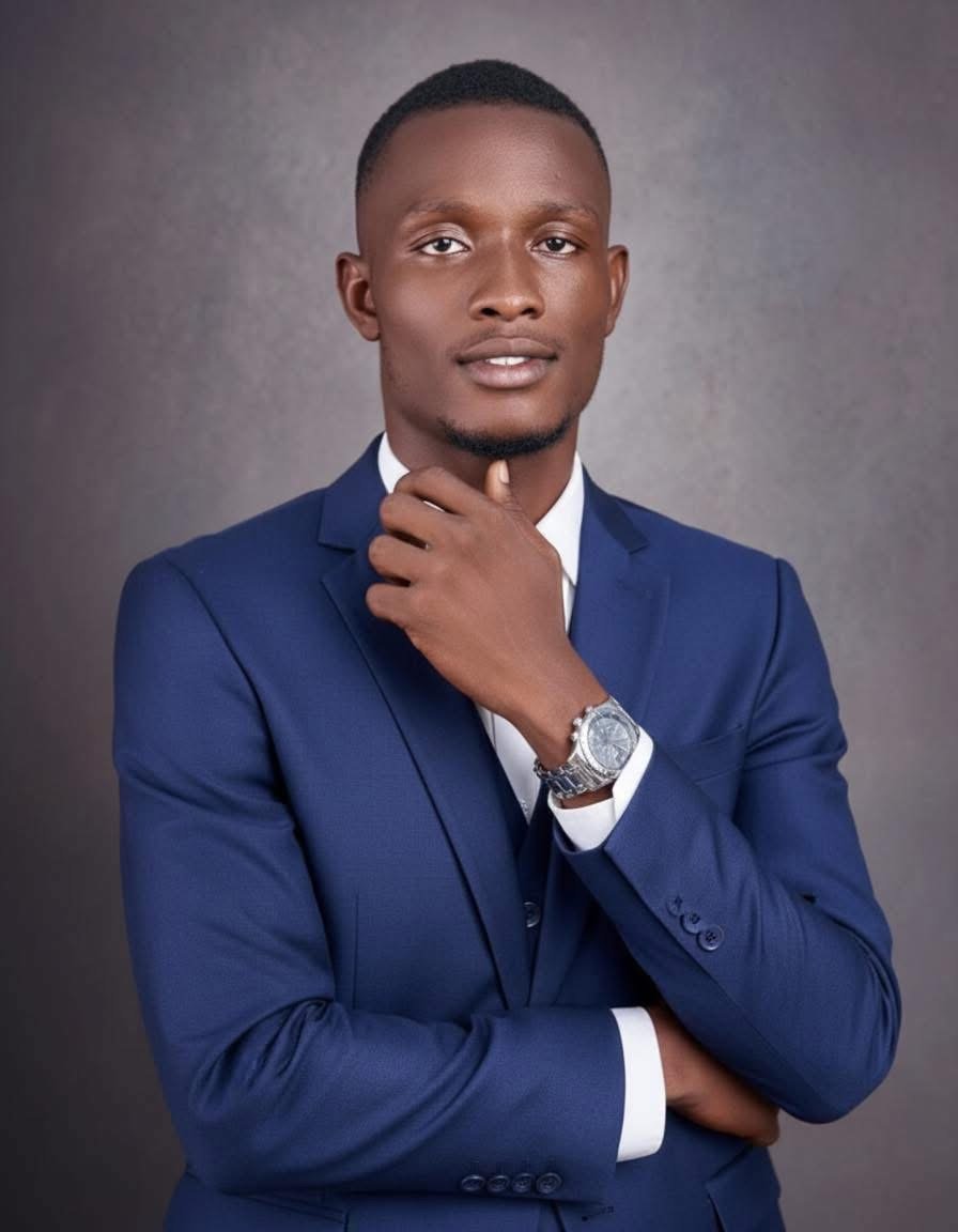 Oluwasegun Fowosere, owner of Emma Websites on Blue suit